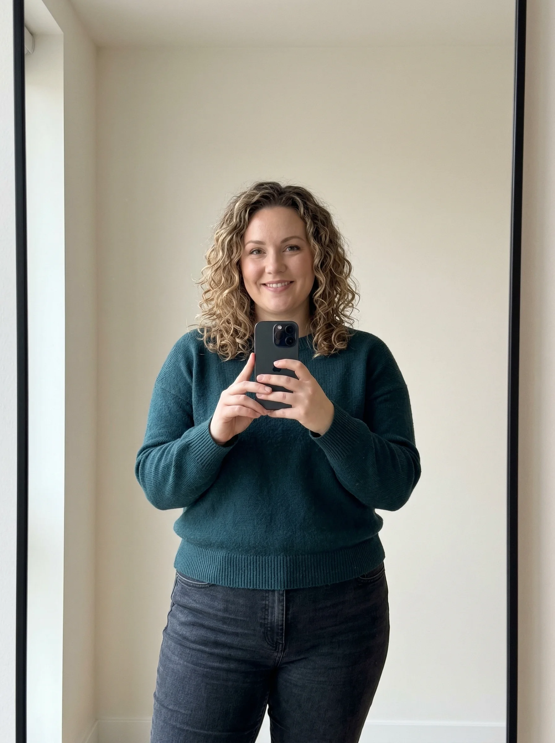 Progress photo in a teal sweater